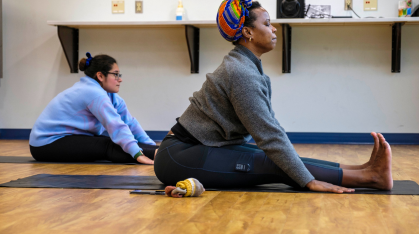 two students doing yoga