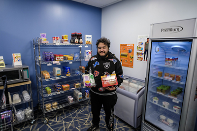 food pantry worker showing available items.