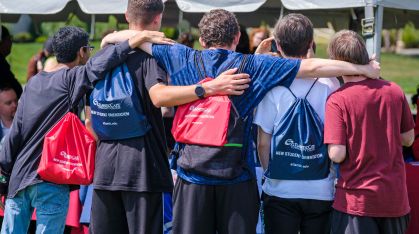 six men linking arms