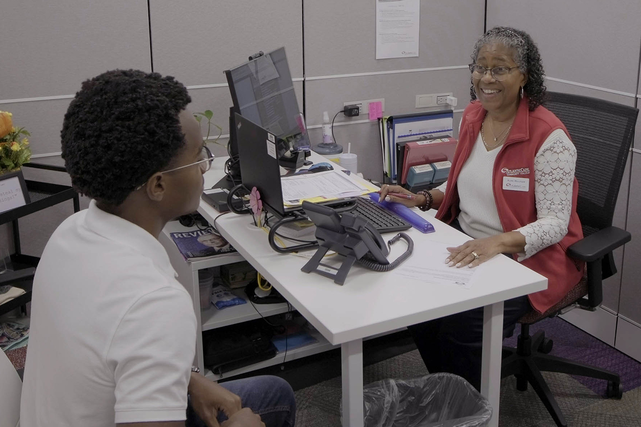 Student getting information from an advisor.