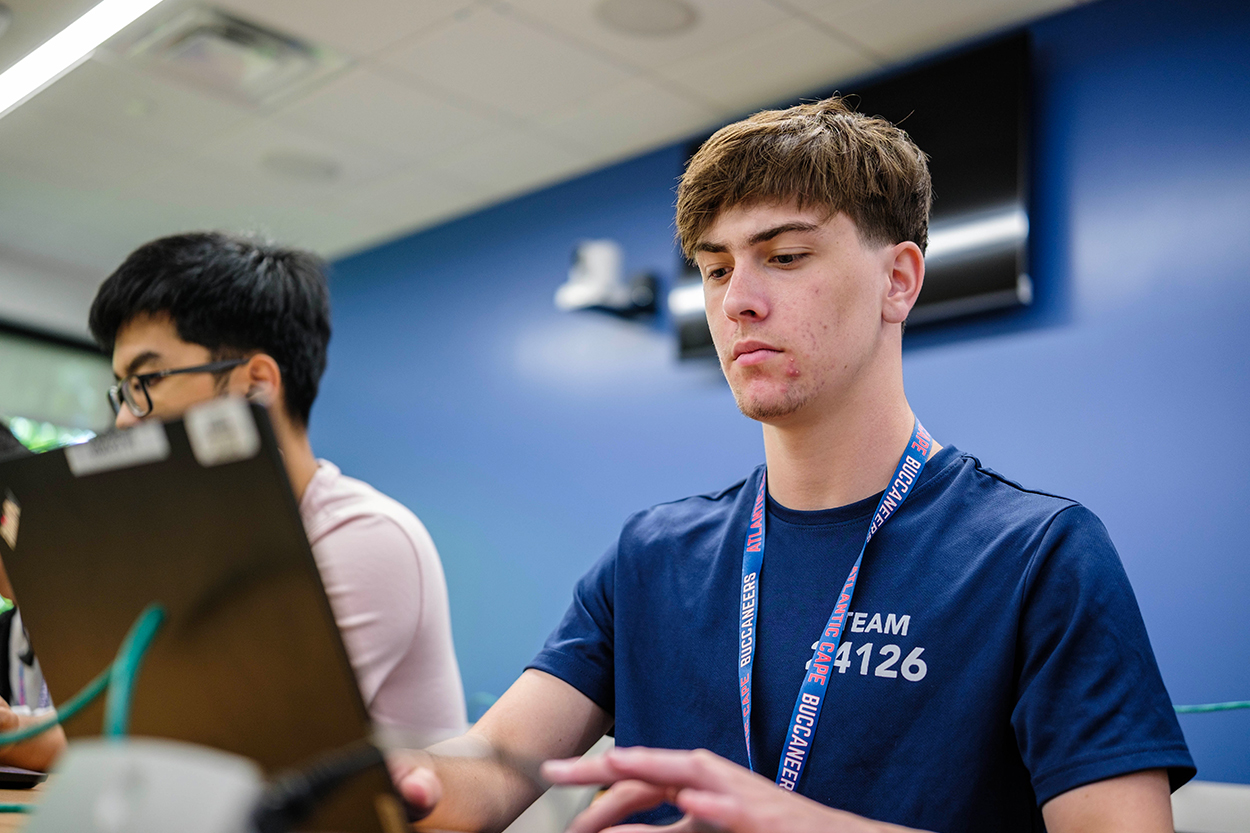 Student at a computer looking up information.