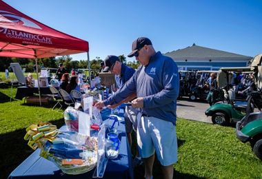 Golfers enter into the 50/50 drawing prior to the golf tournament