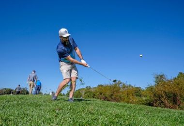 Golfer chipping the ball on the green