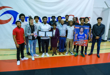 Atlantic Cape President Dr. Barbara Gaba poses with the men's basketball team