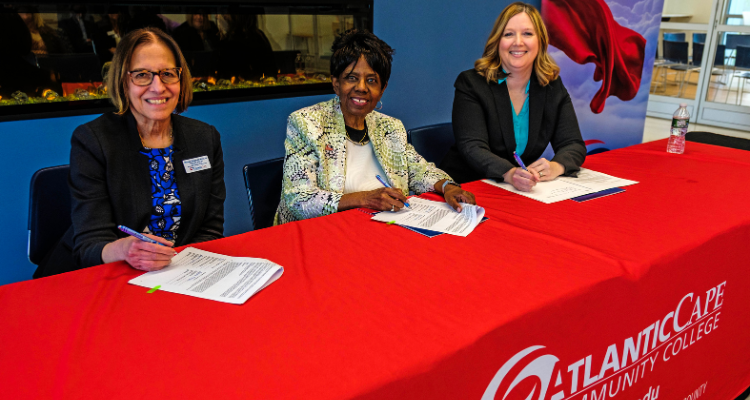 Atlantic Cape's Myrna Morales-Keklak, President Dr. Barbara Gaba and University of Phoenix's Dr. Brandi Morse during the official signing ceremony