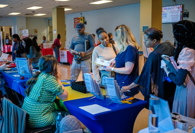 Students in Atlantic City stop to talk at one of the many club tables