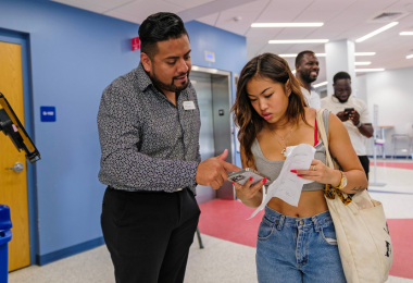 Victor Moreno assists a new Atlantic Cape student on the first day of fall semester