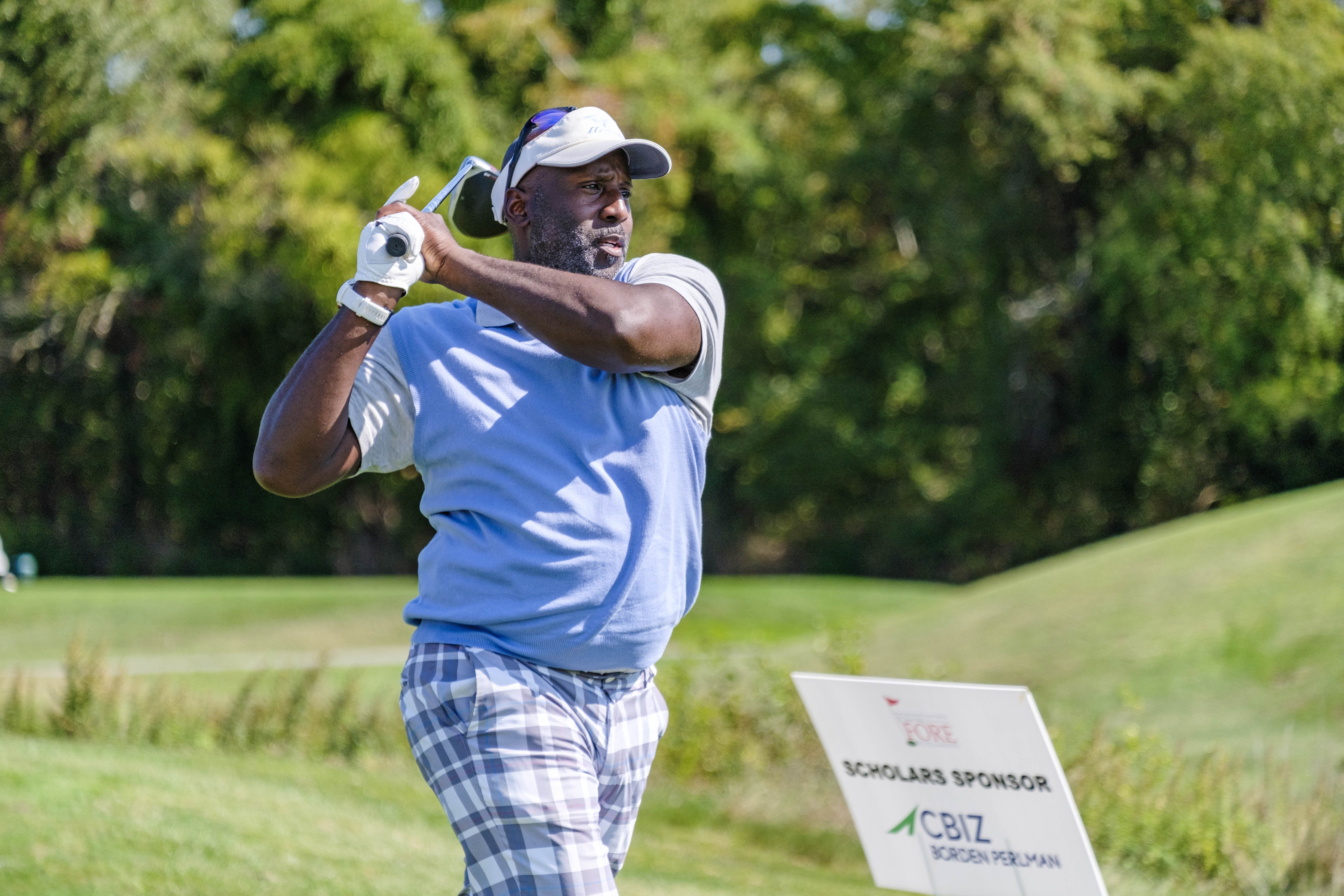 Eric Stewart tees off during golf tournament