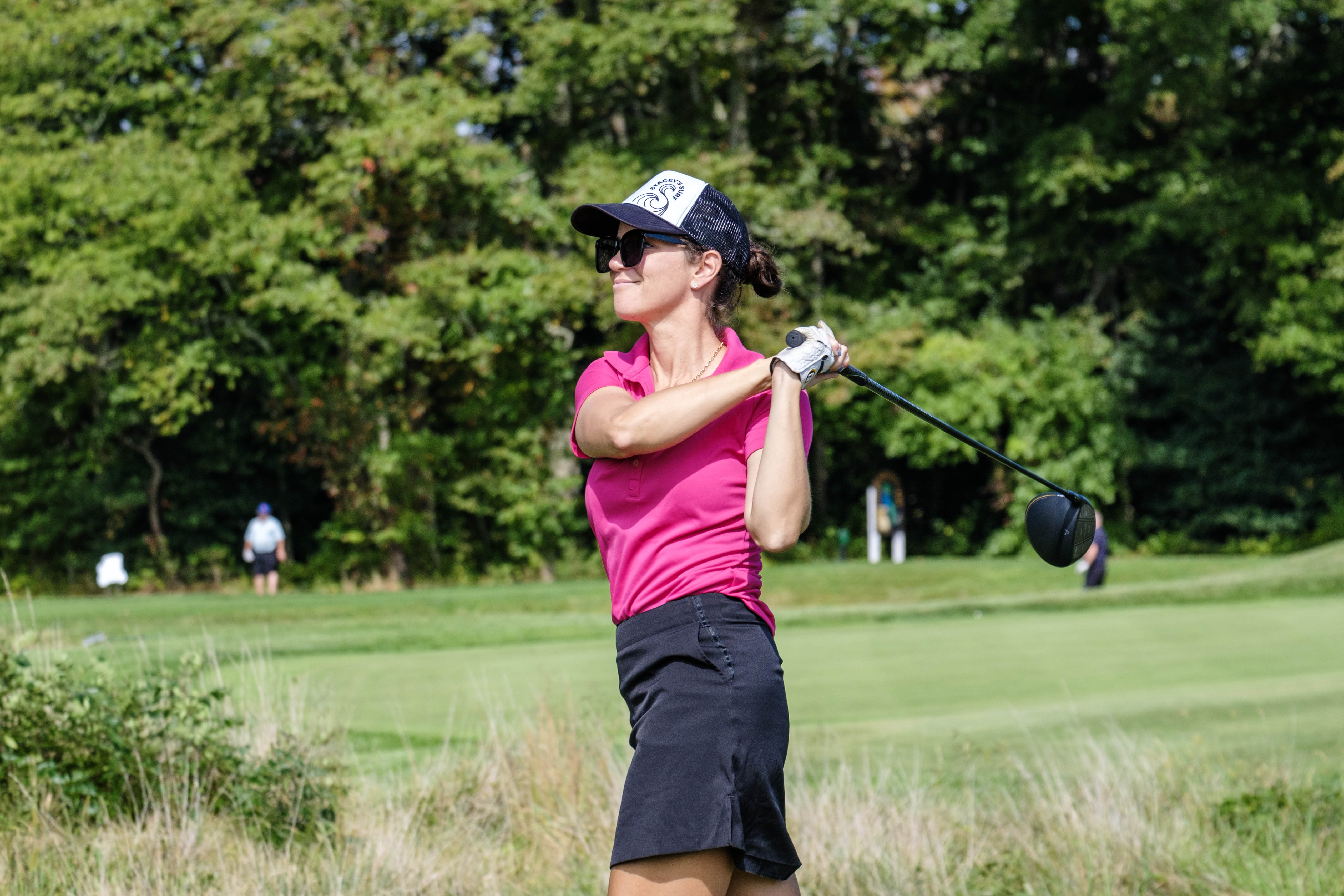 another golfer hits a long drive