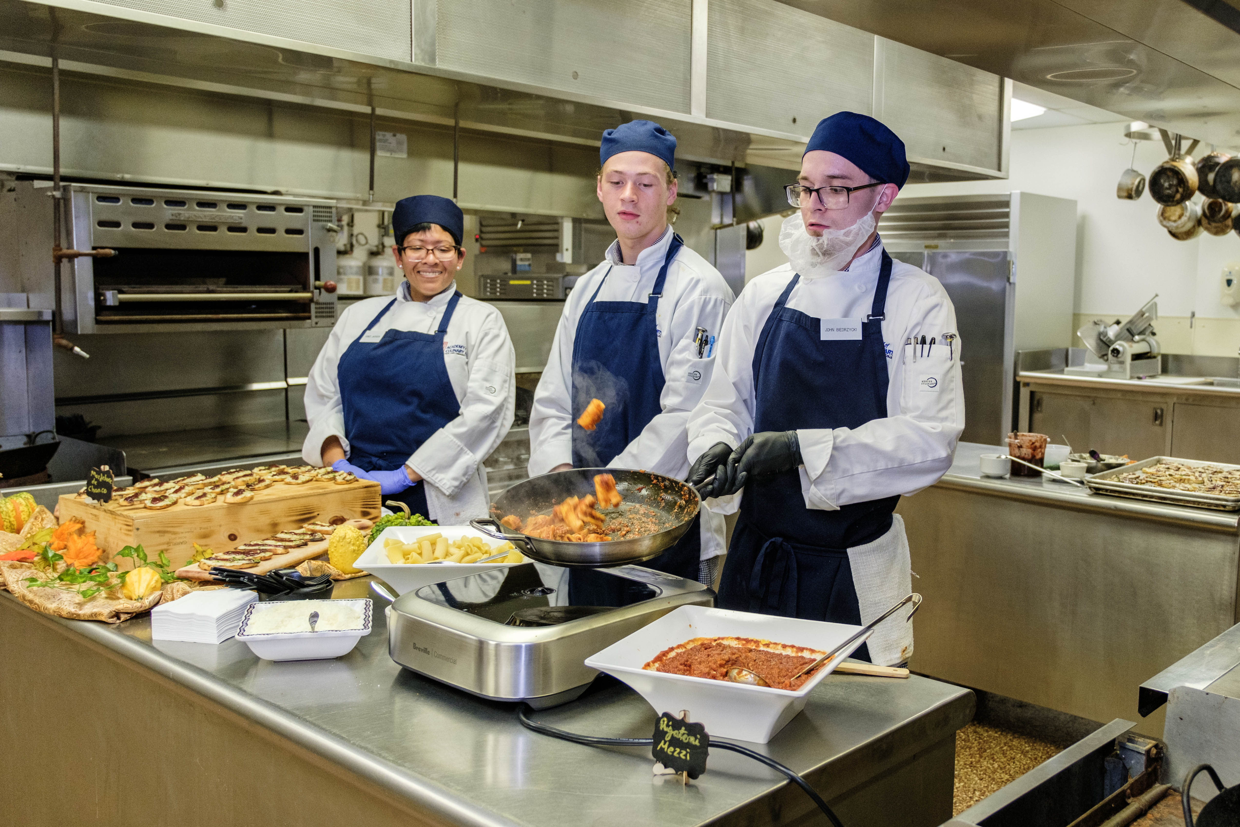 ACA students preparing pasta