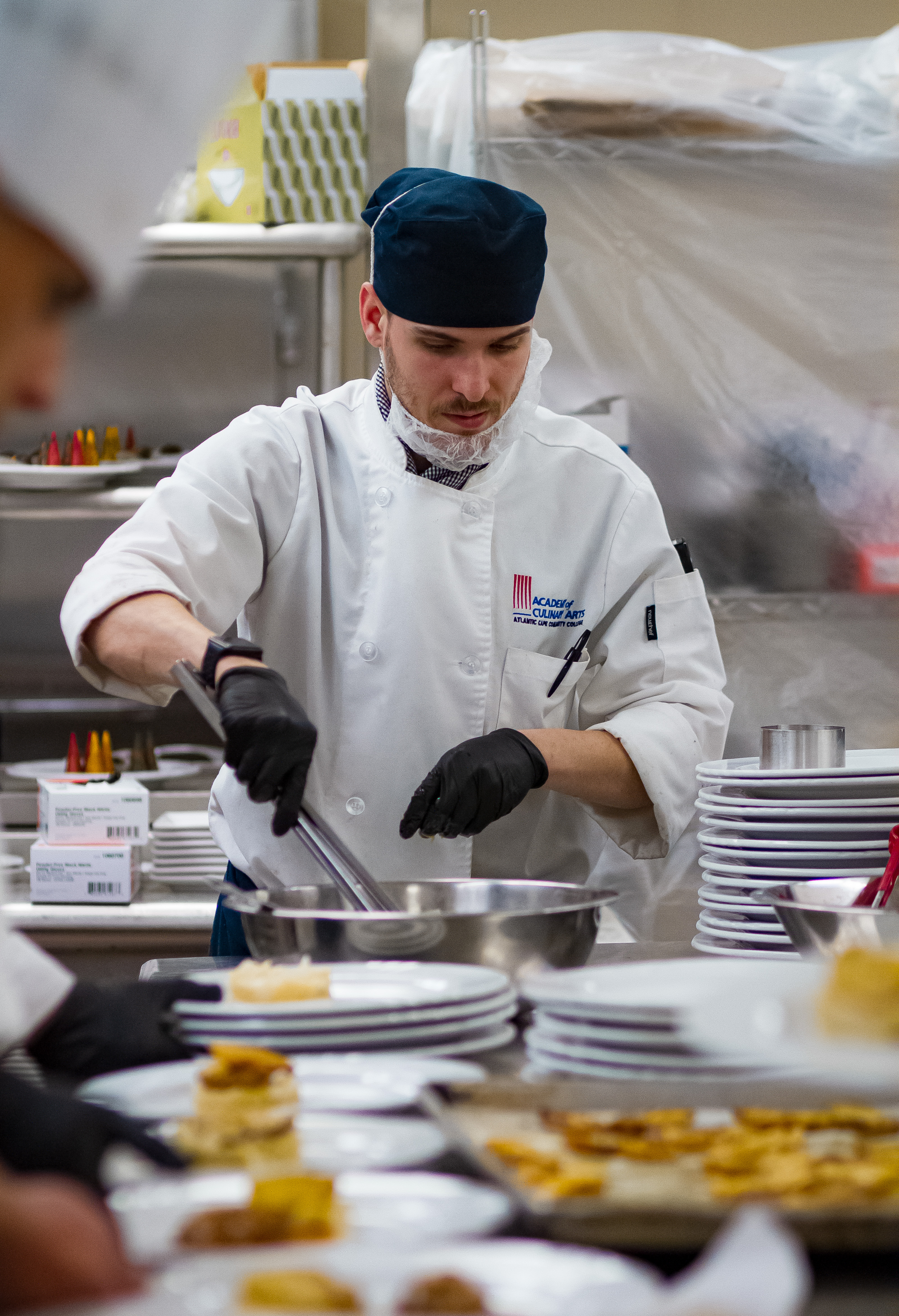 ACA student preparing food for the fundraising dinner