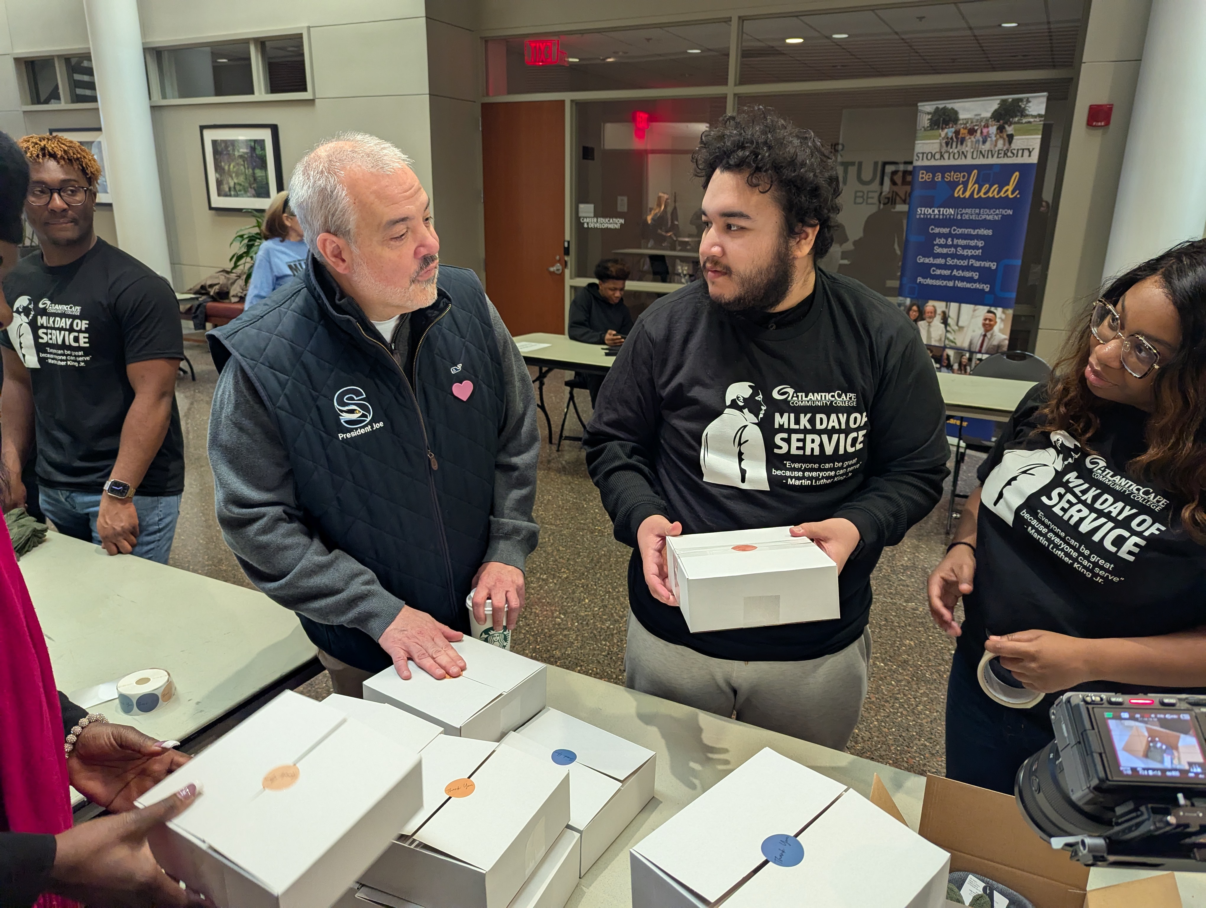 Atlantic Cape students with Stockton President Dr. Joe Bertolino